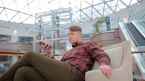 Man records a voice message on a mobile phone. Stock Footage 106029099