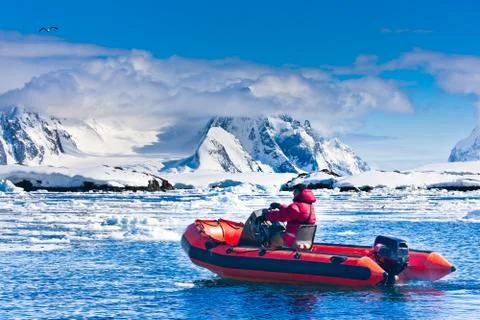 Man in the red boat Stock-Fotos