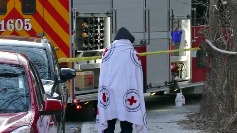 Man with red cross sheet walking desperatly Stock Footage 138542080