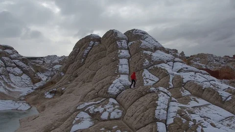 Man Red Jacket Climbs Runs Up Rock Formation, White Pocket, Arizona Stock Footage 101625350