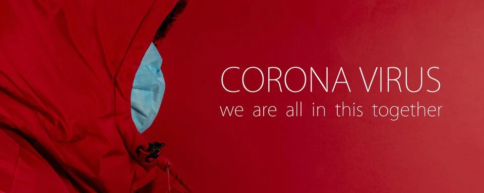 Man in red jacket is using a protective mask against corona virus on red back Stock Photos