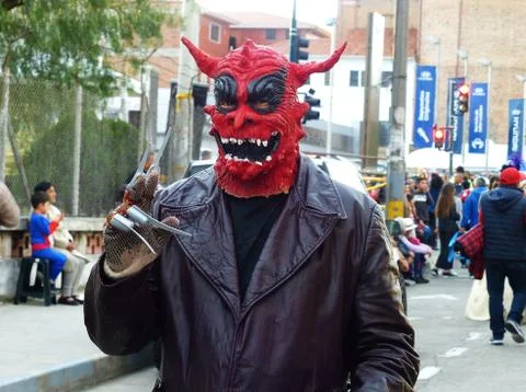 Man in red mask of Devil at the parade, Ecuador Stock Photos