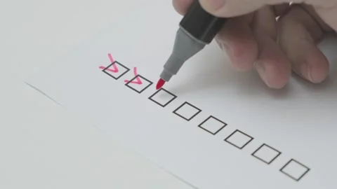 Man red pen marking on checklist boxes Stock Footage 281774225