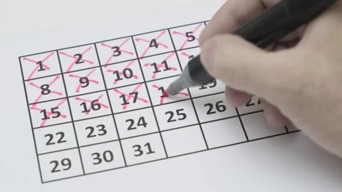 Man red pen marking numbers in calendar grid, closeup 스톡 동영상 281774692