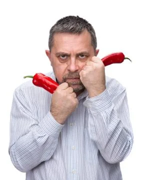 A man with a red pepper Stock Photos