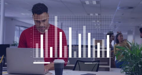 Man in red shirt typing while bar overlay appearing comparing printed reports Stock Footage 315785662