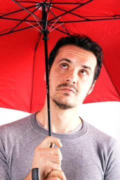 Man with red umbrella Stock Photos