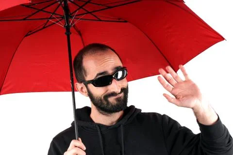 Man with red umbrella Stock Photos