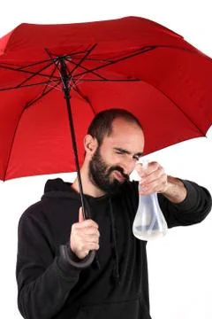 Man with red umbrella Stock Photos
