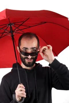 Man with red umbrella Stock Photos