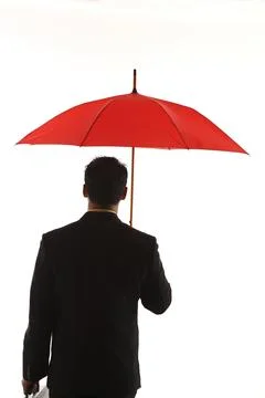 Man with red umbrella Foto stock