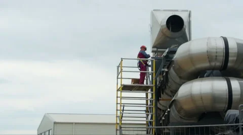 Man in red working Stock Footage 51353311