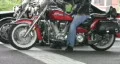 Man on red Yamaha Roadstar motorcycle stopped at an intersection. HD Footage