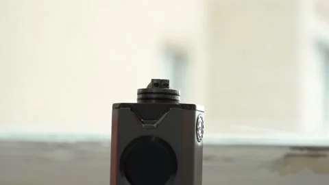Man refills a vape with liquid using a pipette Stock Footage 162039235