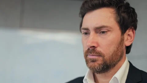 Man Reflects With Serious Expression, Looking Towards Future Stock Footage 330226877