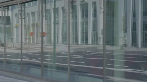 Man reflects from window when he is walking by Stock Footage 64552702