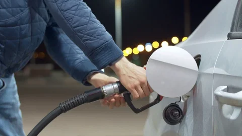 A man refueling a car Stock Footage 128829143