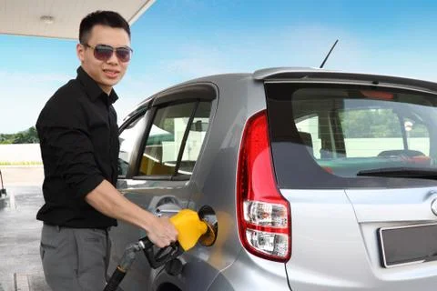 Man refuelling a car Stock Photos