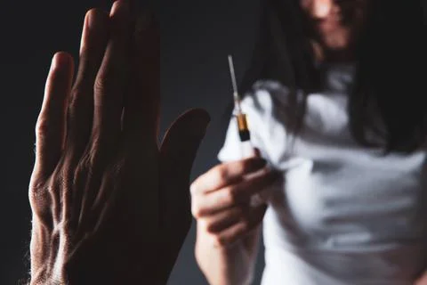 The man refuses to accept the syringe Stock Photos