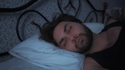 A man refuses to wake up during self-isolation due to coronavirus quarantine. Stock Footage 127710930