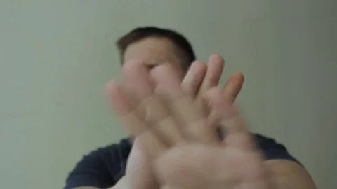 Man refusing and shaking his hands in front of a camera. Video stock 77413442