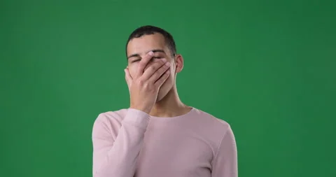 Man regretting his wrongdoing over green background Stock Footage 146048764