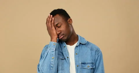 Man regretting wrongdoing over green background Stock Footage 146639562