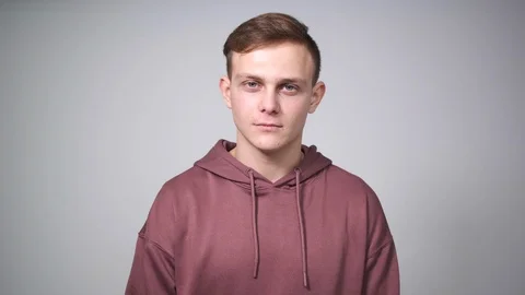 Man regretting wrongdoing over white background Stock Footage 126045210