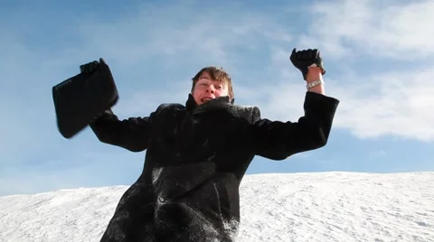 The man rejoices against the snow slope Stock Footage