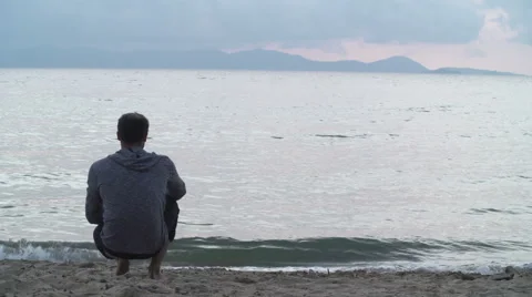 Man relax on beach at sunset 動画素材 64558961
