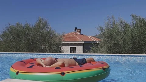 Man relax in swimming pool Stock Footage 137015315