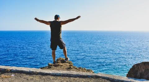 A Man relaxes while looking the sea Stock Illustration