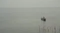 Man relaxing and fishing in a little boat in Sri Lanka HD Footage