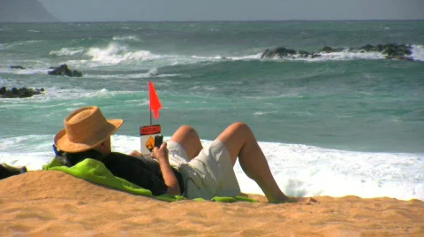 Man relaxing on beach Stock Footage 144683