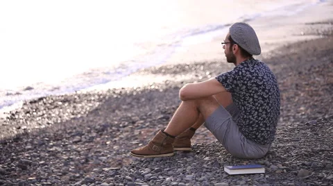 Man relaxing on the beach Stock Footage 58253209