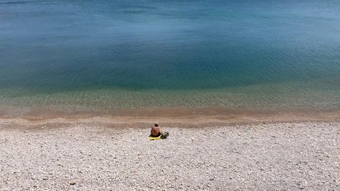 Man relaxing on the beach in Spain Stock Footage 240910772