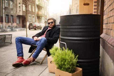 Man relaxing on the deckchair Stock Photos