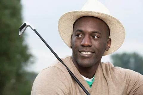 Man relaxing at the golf course Stock Photos