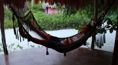 Man Relaxing in a Hammock Stock Footage 46034889