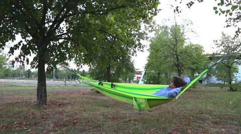 Man Relaxing in a Hammock Stock Footage 57258057