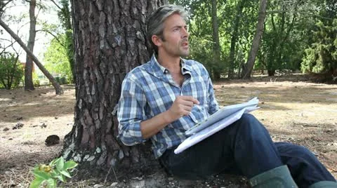 Man relaxing in nature with tablet Stock Footage 14822214