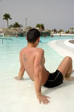 Man relaxing in pool Stock Photos