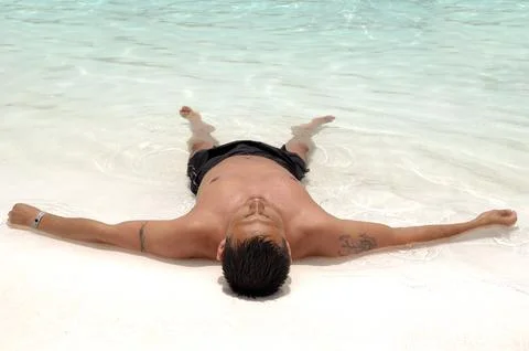 Man relaxing in pool Stock Photos