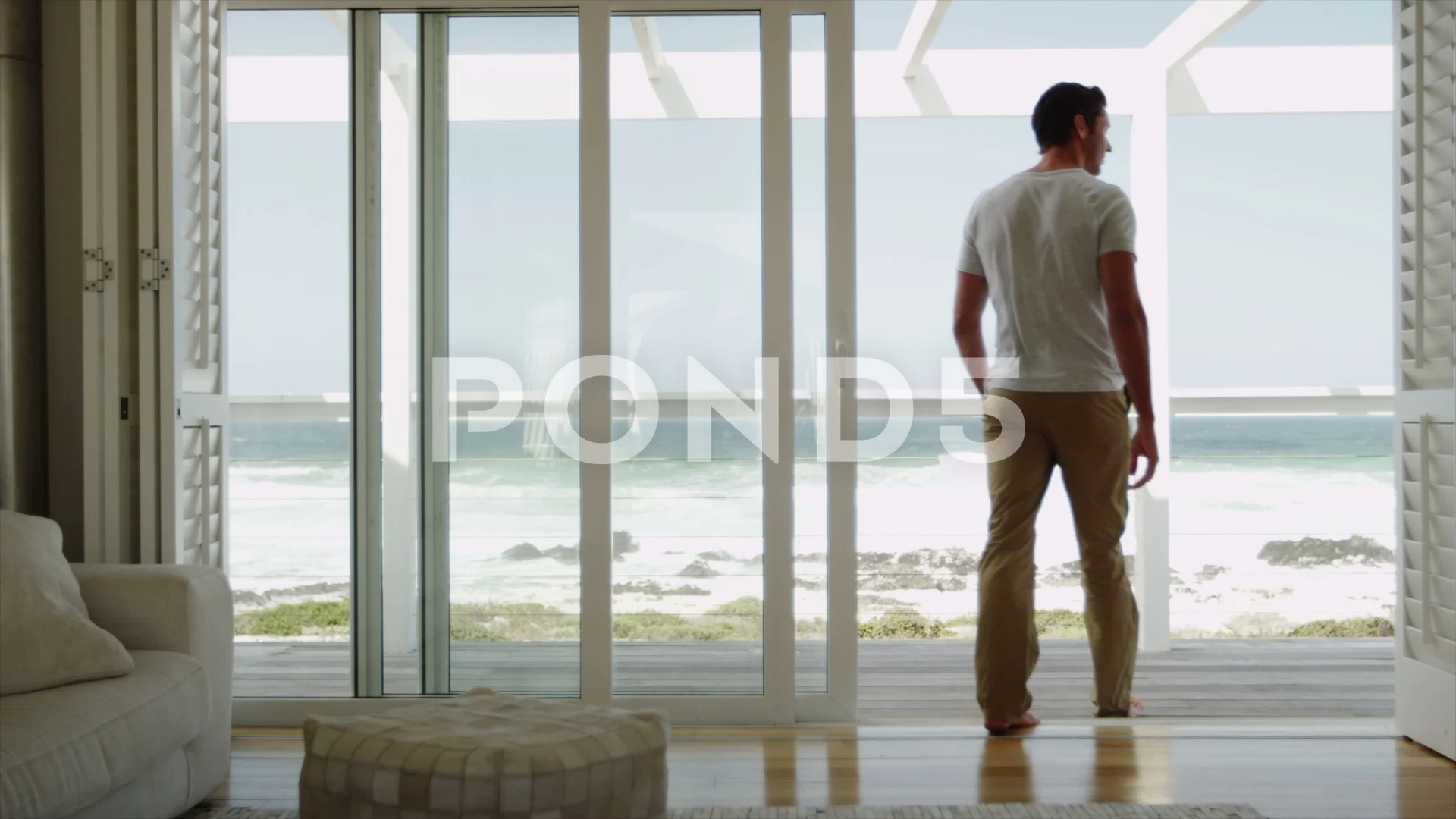 man-relaxing-porch-modern-beach-footage-123234820_prevstill.jpeg