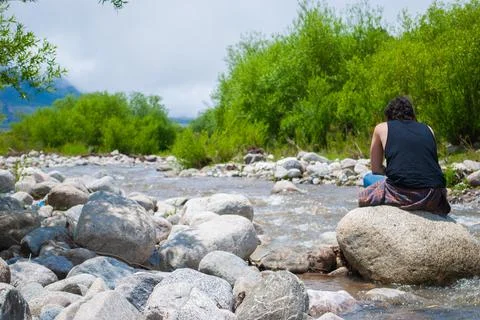 Man relaxing in a river Stock Photos