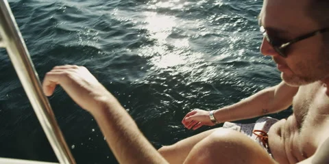 Man relaxing on sailboat Stock Footage 58861704