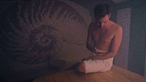 Man Relaxing In Sauna Video stock 78629786