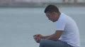 Man relaxing on the shore in Panama City 4k or 4k+ Resolution