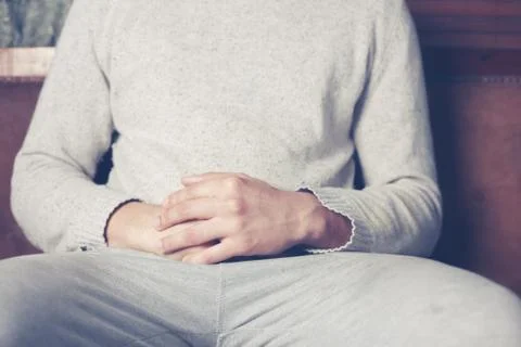Man relaxing on sofa Stock Photos