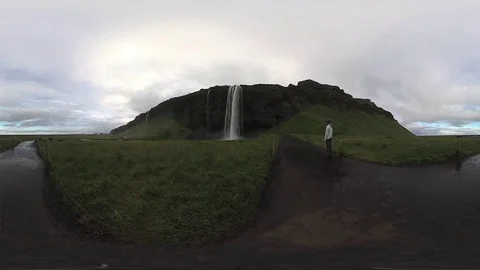 Man Relaxing by Waterfall in Iceland 360 Immersive Experience Stock Footage
